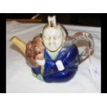 A 19th century Minton Mintons Majolica teapot of an oriental gentleman in cobalt robe, holding a Noh