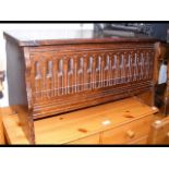 A reproduction oak coffer with carved front