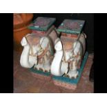 A pair of decorative glazed ceramic Elephant garde