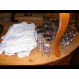 A collection of silver-rimmed glass champagne flut