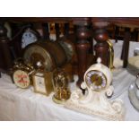 A collection of various mantel clocks including a
