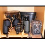 Three pairs of cased binoculars together with a vi