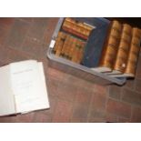 A collection of assorted leather bound volumes, in