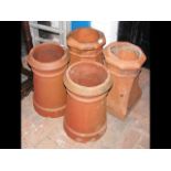 Four old terracotta chimney pots