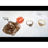 Two gold dress rings, a coral brooch and one other