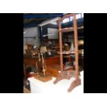 A carved hardwood cake stand, brass bound writing