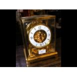 A Jaeger-LeCoultre Atmos clock in four glass case