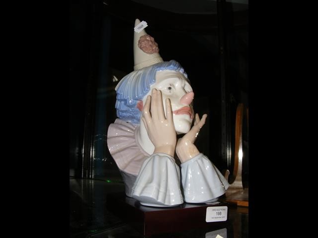 A large Lladro figure of sad clown - 31cm high on