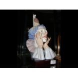 A large Lladro figure of sad clown - 31cm high on