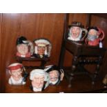 Seven collectable Royal Doulton character jugs, in