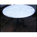 A 90cm diameter marble top and cast metal garden t