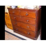 A mahogany chest of draws comprising two short and