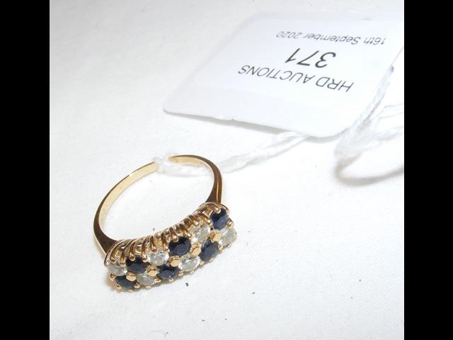 A diamond and sapphire ring in 18ct gold setting