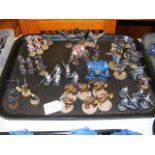 A cluster of assembled and painted Games Workshop Warhammer 40000, Warhammer Age of Sigmar and Warha