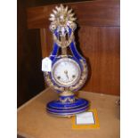 A reproduction French 18th century lyre clock by F