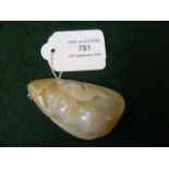 An intricately carved jade pendant - 7cm long