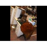 A tilt top table with pie crust top, vintage knife