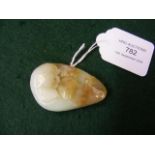 An intricately carved jade pendant - featuring kis