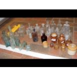 A selection of collectable glass and stone bottles