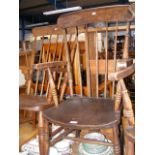 A Windsor stick back arm chair with turned legs