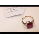 A red stone lady's dress ring in 9ct gold setting