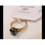 A green stone lady's dress ring in 22ct gold setti