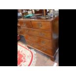 A Georgian mahogany chest of two short and three l