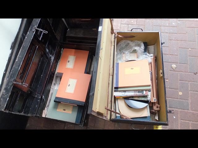 An old steel travelling trunk, containing various