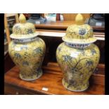 A pair of reproduction Chinese yellow ochre jars a