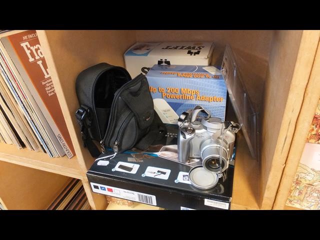 A pair of boxed Swift binoculars, cased Canon came