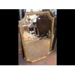 A gilt framed wall mirror