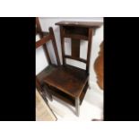 An unusual prayer/hall chair with hinged lift-up seat