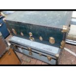 A vintage travelling trunk and one other