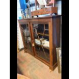 An Edwardian two door glazed bookcase