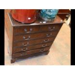 A reproduction inlaid mahogany chest of two short