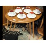 A nest of three Ercol Golden Dawn pebble tables