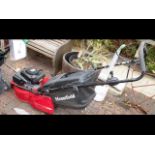 A petrol driven Mountfield lawnmower