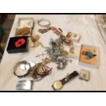 A bag of assorted costume jewellery including Scot