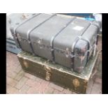 A vintage travelling trunk and one other