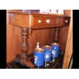 A Victorian mahogany two drawer side table on turn