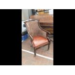 A Regency mahogany Berger chair, leather squab cus