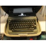 A cased vintage Olympia typewriter