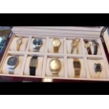 A collection of twelve wrist watches in presentati