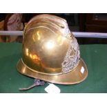 An antique French brass Fireman's helmet