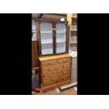 A pine chest of two short and three long drawers -