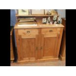 A pine chiffonier with shaped back, two drawers an