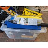 A plastic box containing various useful tools, inc