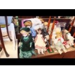 A large collection of reproduction dolls etc