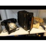 A vintage black Bakelite telephone, a retro teleph