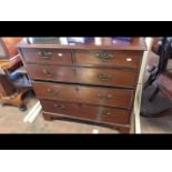 A Georgian mahogany chest of two short and three l